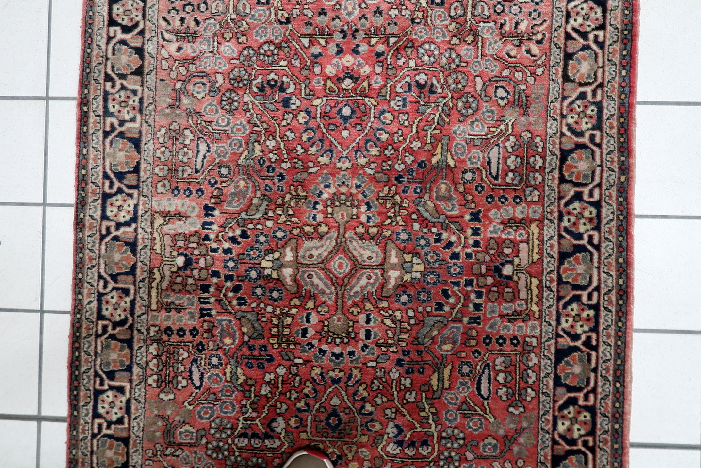 Close-up of the traditional all-over Herati pattern on a 1950s Persian Hamadan rug, showing stylized floral motifs and delicate leaf work.

