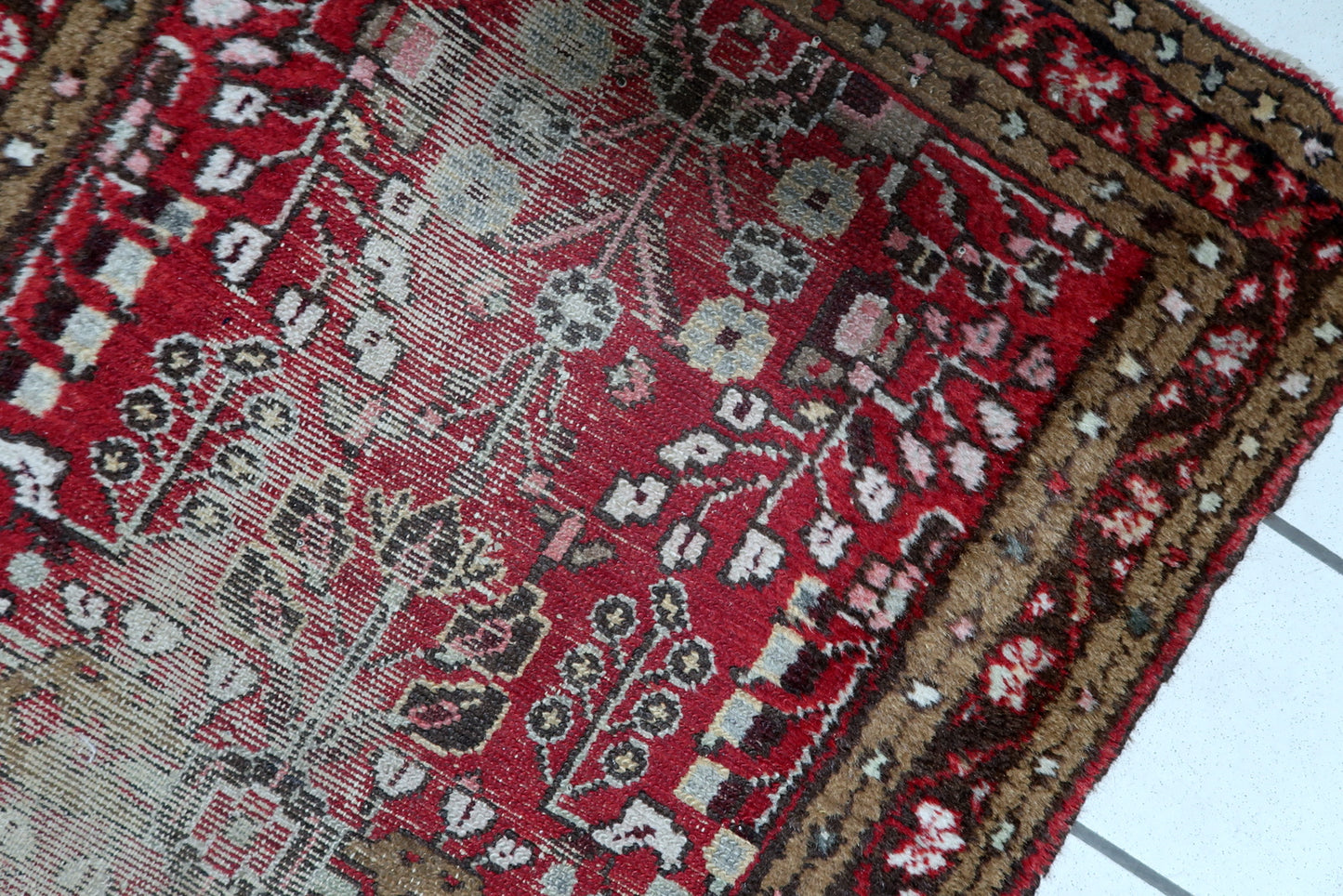Handmade antique Hamadan carpet in distressed condition, ideal for collectors of Wabi-sabi or rustic interiors. Circa 1920s.

