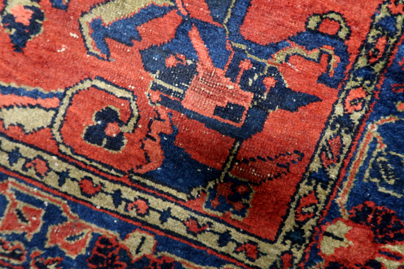 Areas of low pile on an antique Lilihan rug, contributing to its genuine patina and telling the story of its century-long history.


