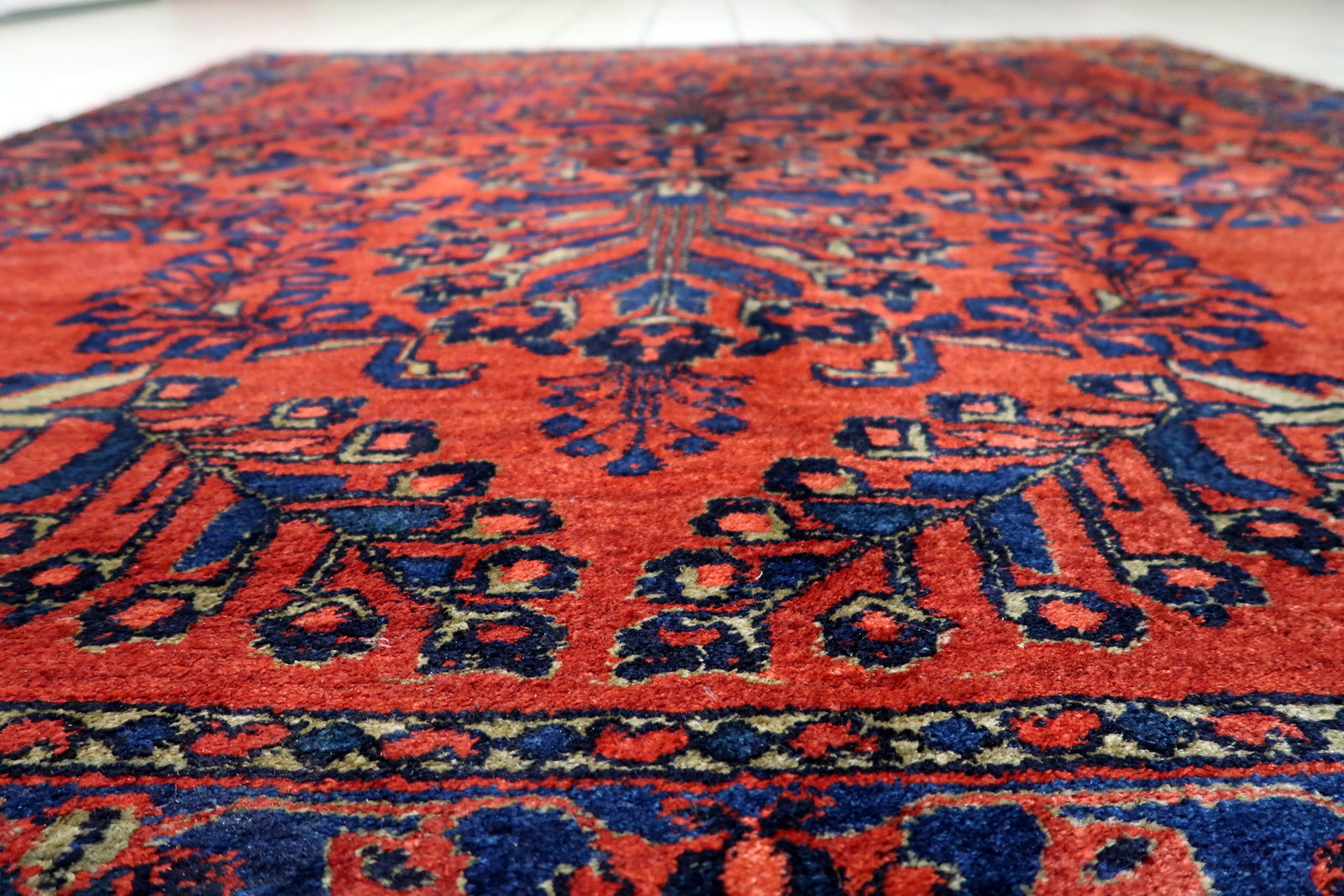 Vintage Persian rug in generally good condition, perfect for collectors seeking curvilinear floral motifs and a balanced symmetrical composition.

