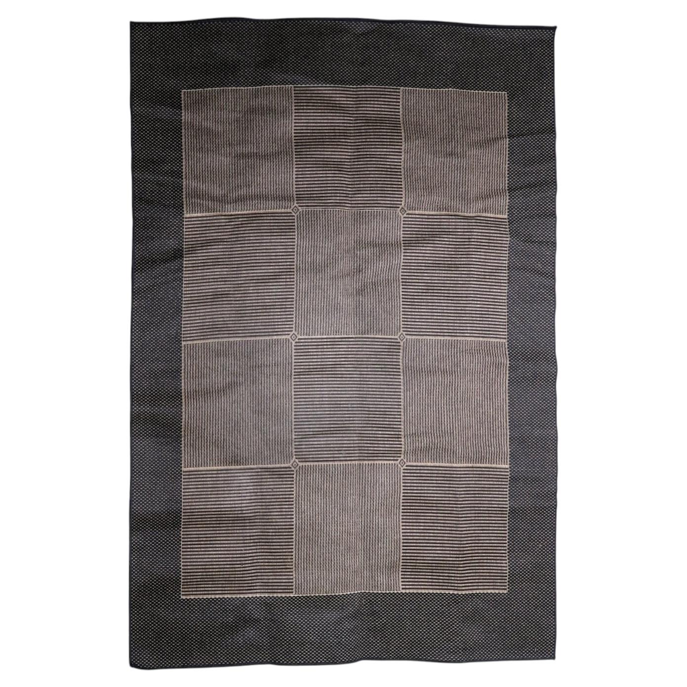 Vintage 1980s Belgian modern rug, machine-woven polypropylene, featuring a minimalist grid design in charcoal grey and soft taupe. 200 x 281 cm.

