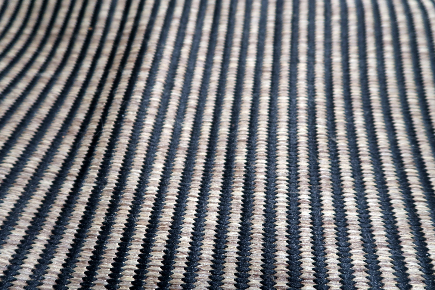 Vintage Belgian modern rug serving as a sophisticated foundation in an industrial loft, adding depth without overwhelming the space.

