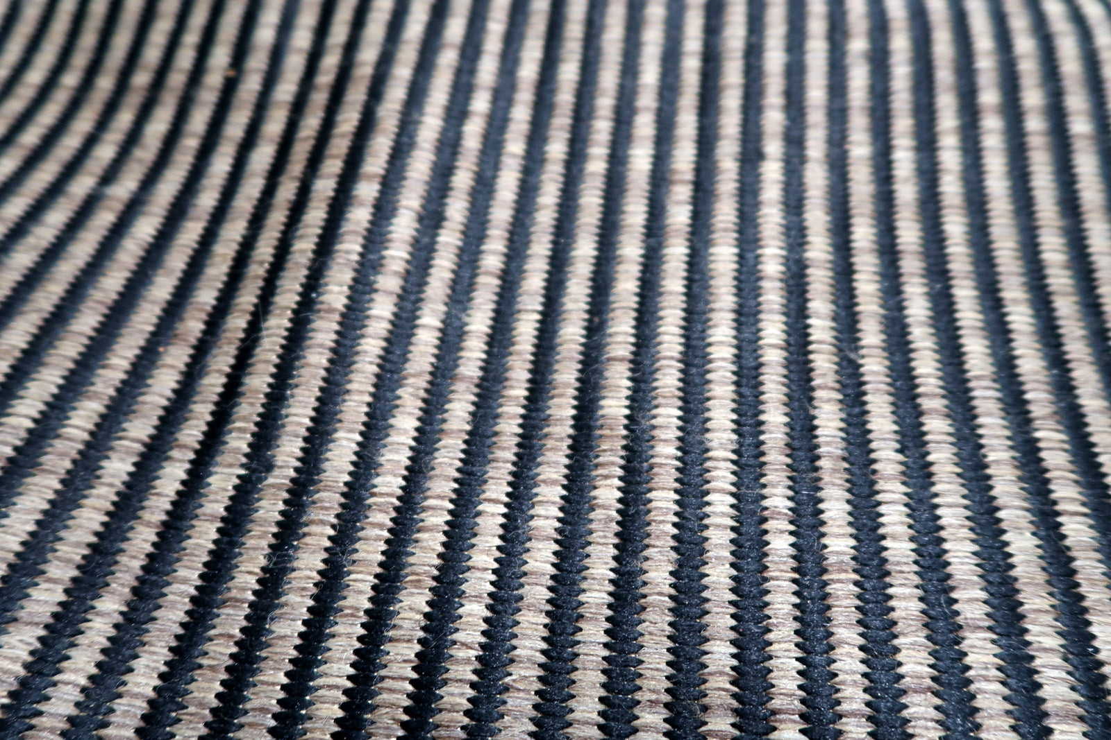 Vintage Belgian modern rug serving as a sophisticated foundation in an industrial loft, adding depth without overwhelming the space.

