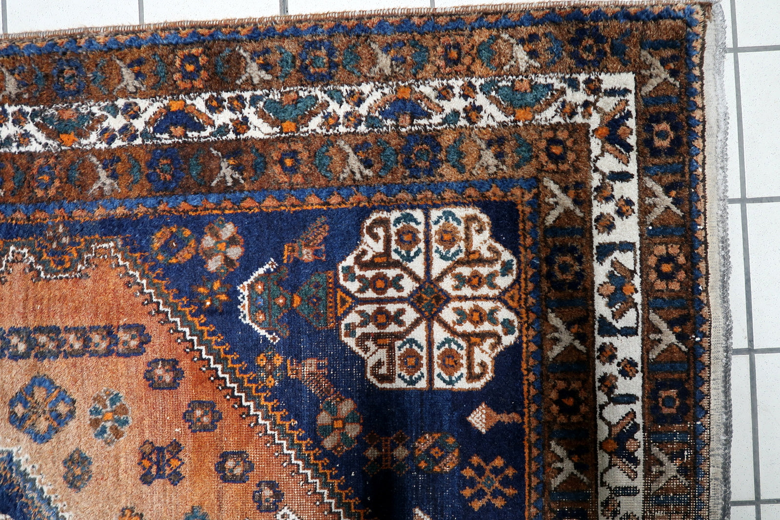 Large Persian tribal rug (155 cm x 207 cm) with a soulful, century-old character, low pile areas, and natural "abrash" color shifts.

