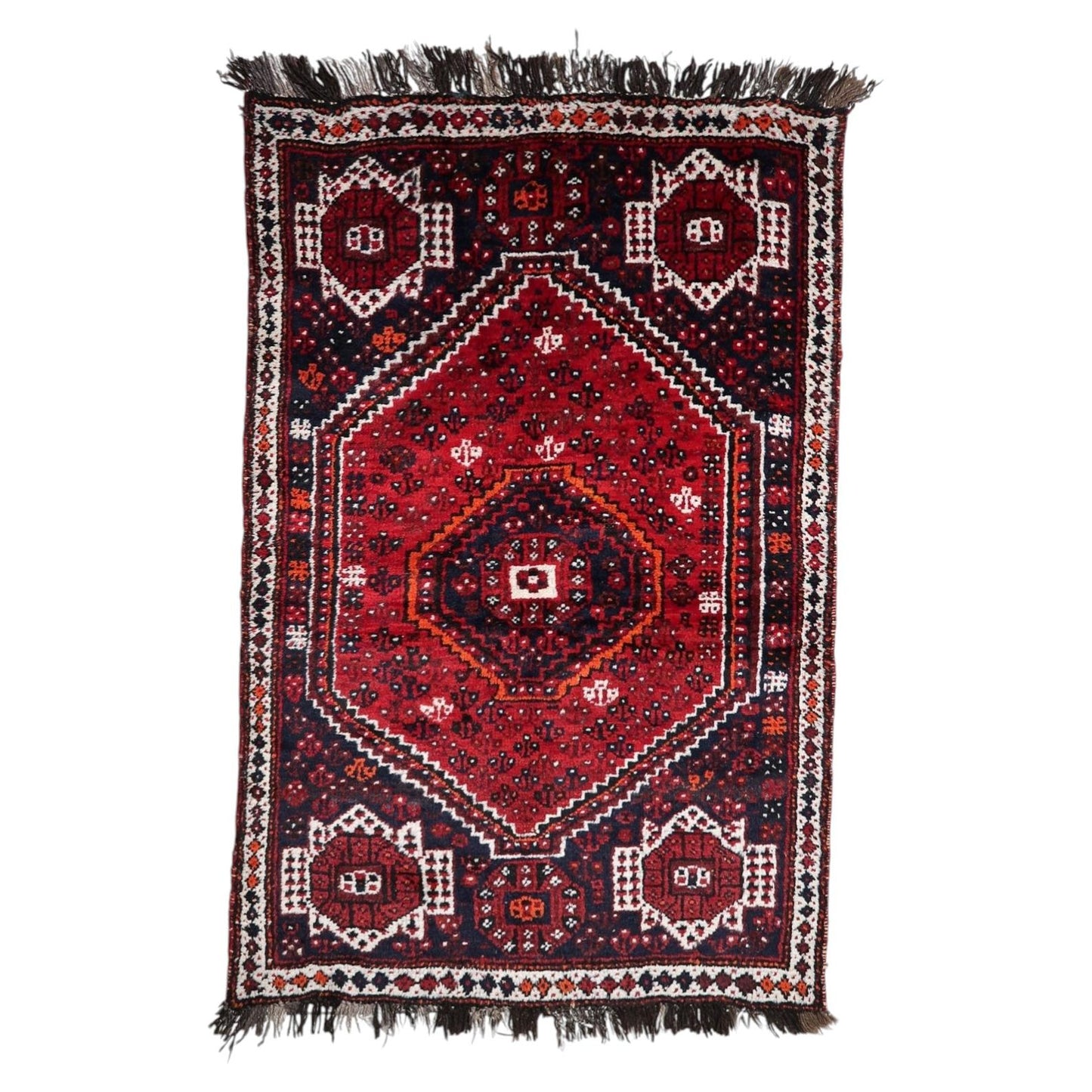 Vibrant antique 1920s Persian Shiraz rug with triple hexagonal medallion design on red field, 4.4 x 6.6 feet.

