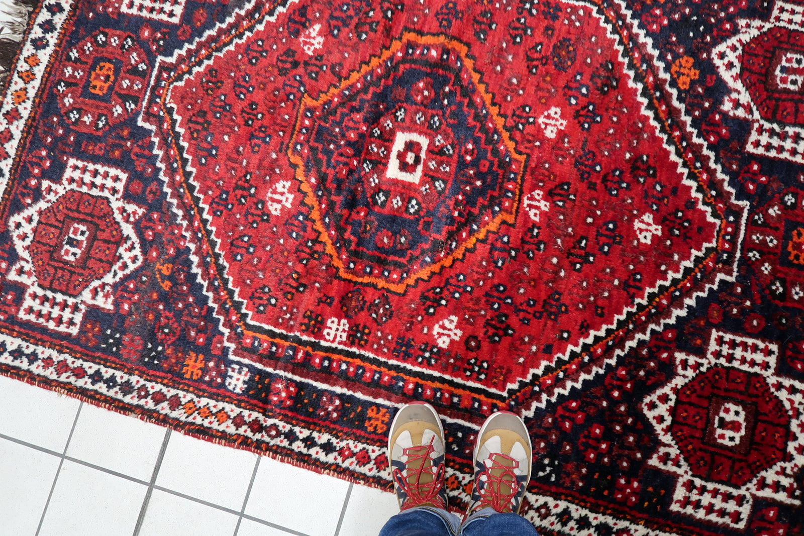 Small antique Persian carpet 132 x 198 cm with well-preserved pile and authentic age-related character.
