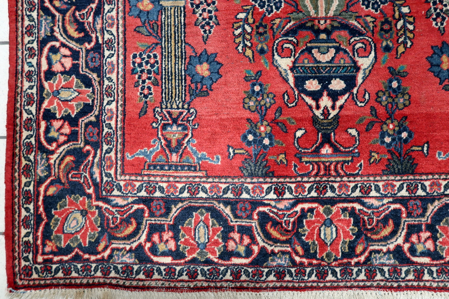Vintage Persian Kashan prayer carpet with Mihrab arch, columns, and intricate floral sprays on spandrels.
