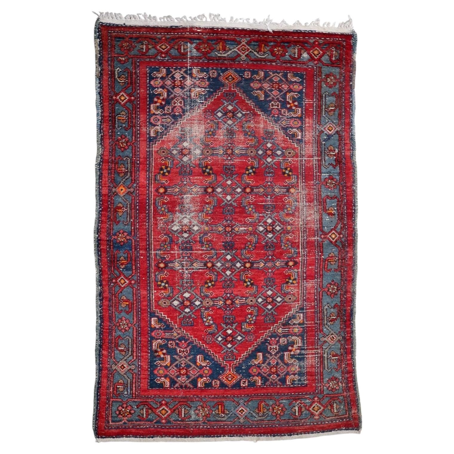 Antique Persian Hamadan distressed rug from the 1920s with geometric diamond medallion on madder-red field, 4.2 x 6.7 feet