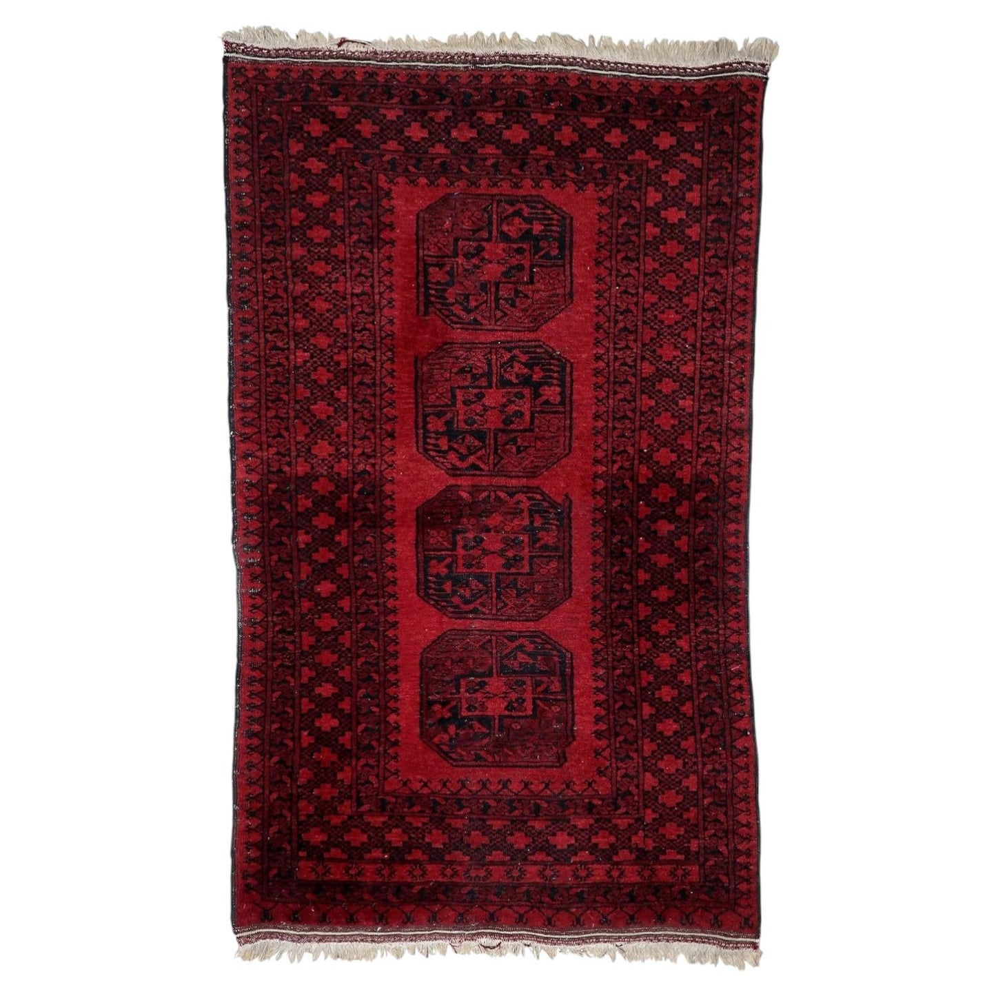 Antique Afghan Ersari rug from the 1920s with four large octagonal elephant foot guls on deep madder-red field, 3.9 x 6.4 feet