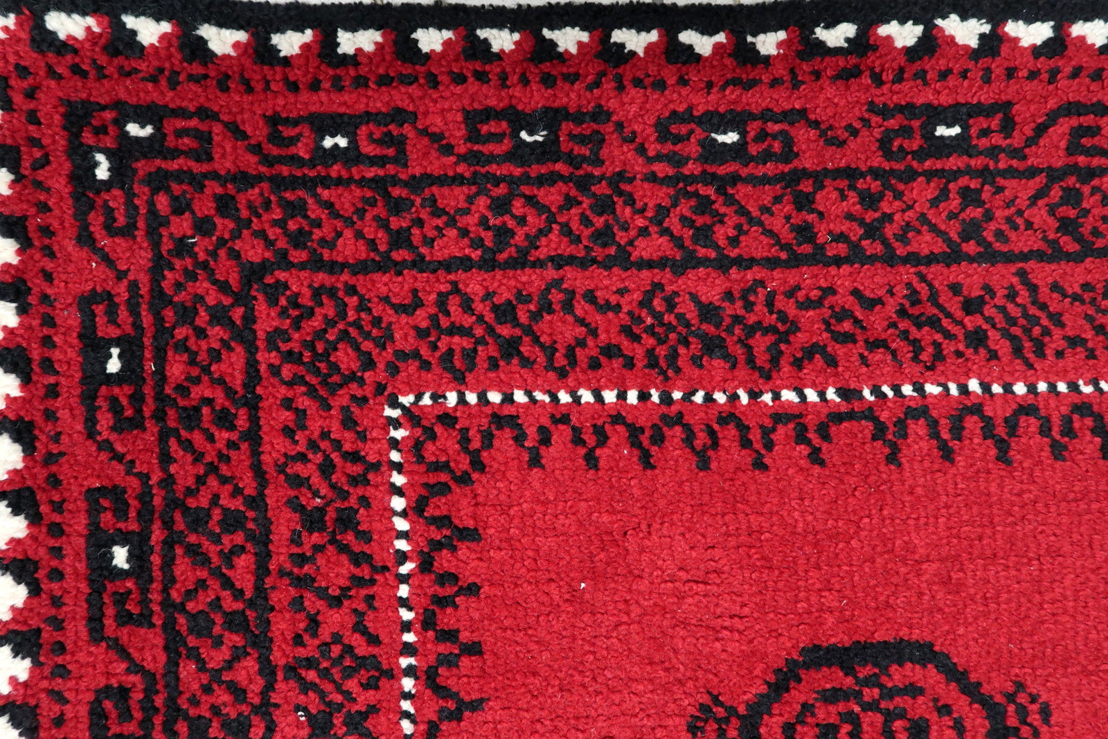 Full view of a neoclassical French rug featuring symmetrical medallion column and formal Greek key borders