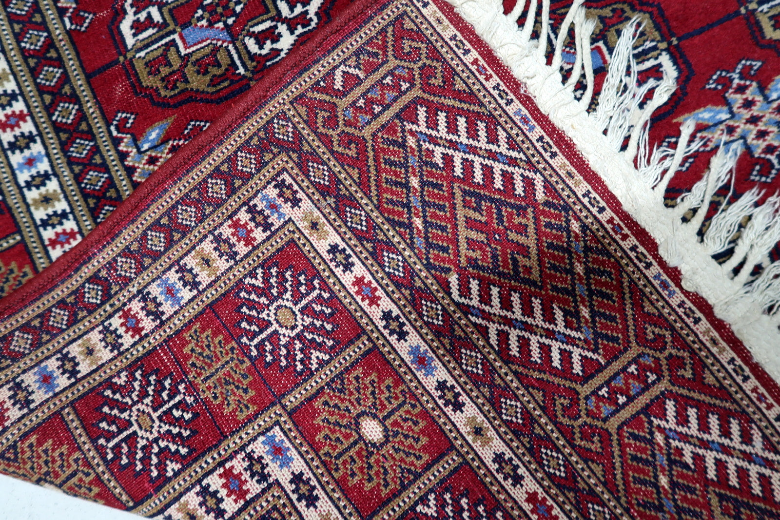 1960s hand-knotted Bukhara rug suitable as versatile anchor for classic or contemporary interiors