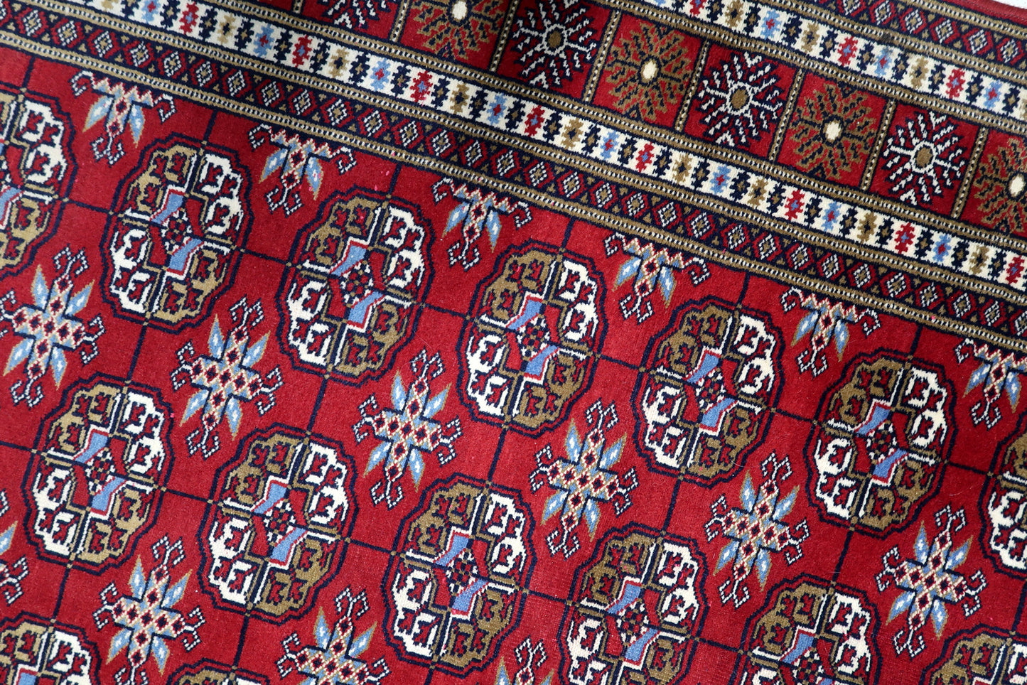 High knot count wool pile texture of a hand-knotted Uzbek rug in excellent vintage condition with vibrant colors