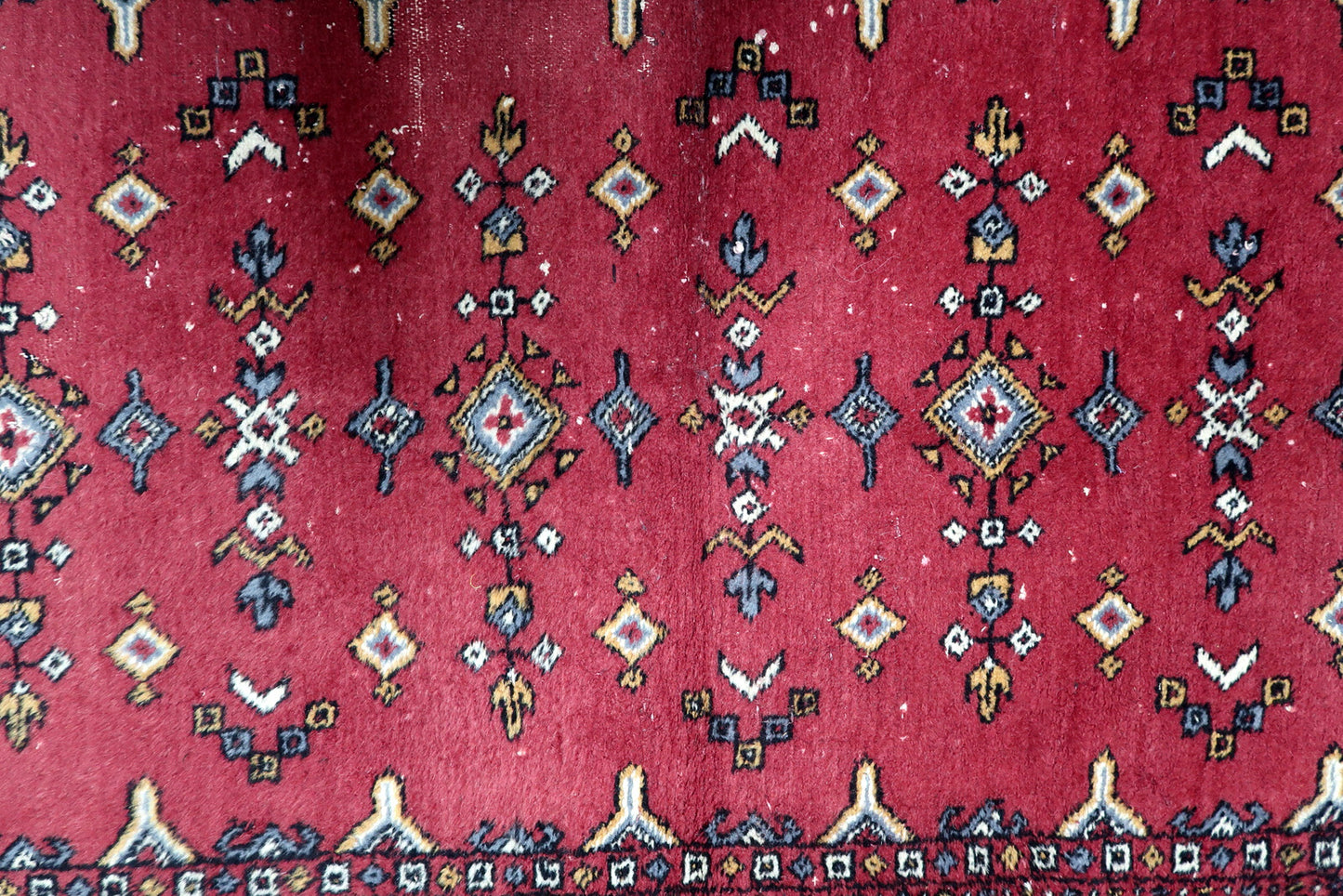 Rich red, deep blue, ivory and gold vintage Uzbek rug with symmetrical diamond medallions and arrow motifs