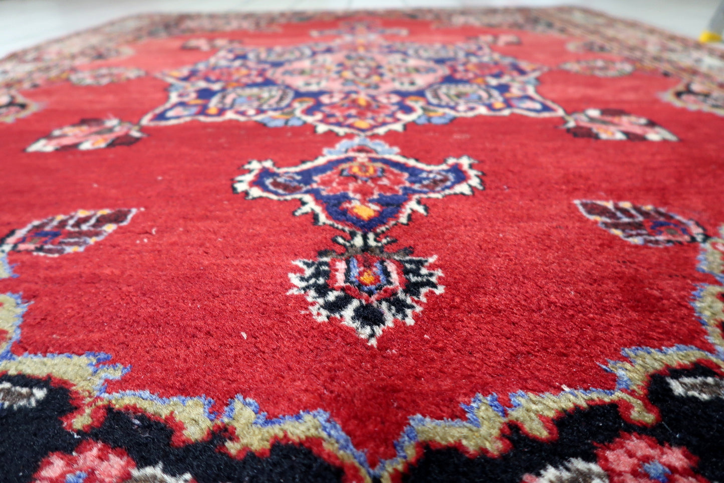 4 foot 4 by 5 foot 9 antique Persian rug ideal for living rooms, bedrooms or studies