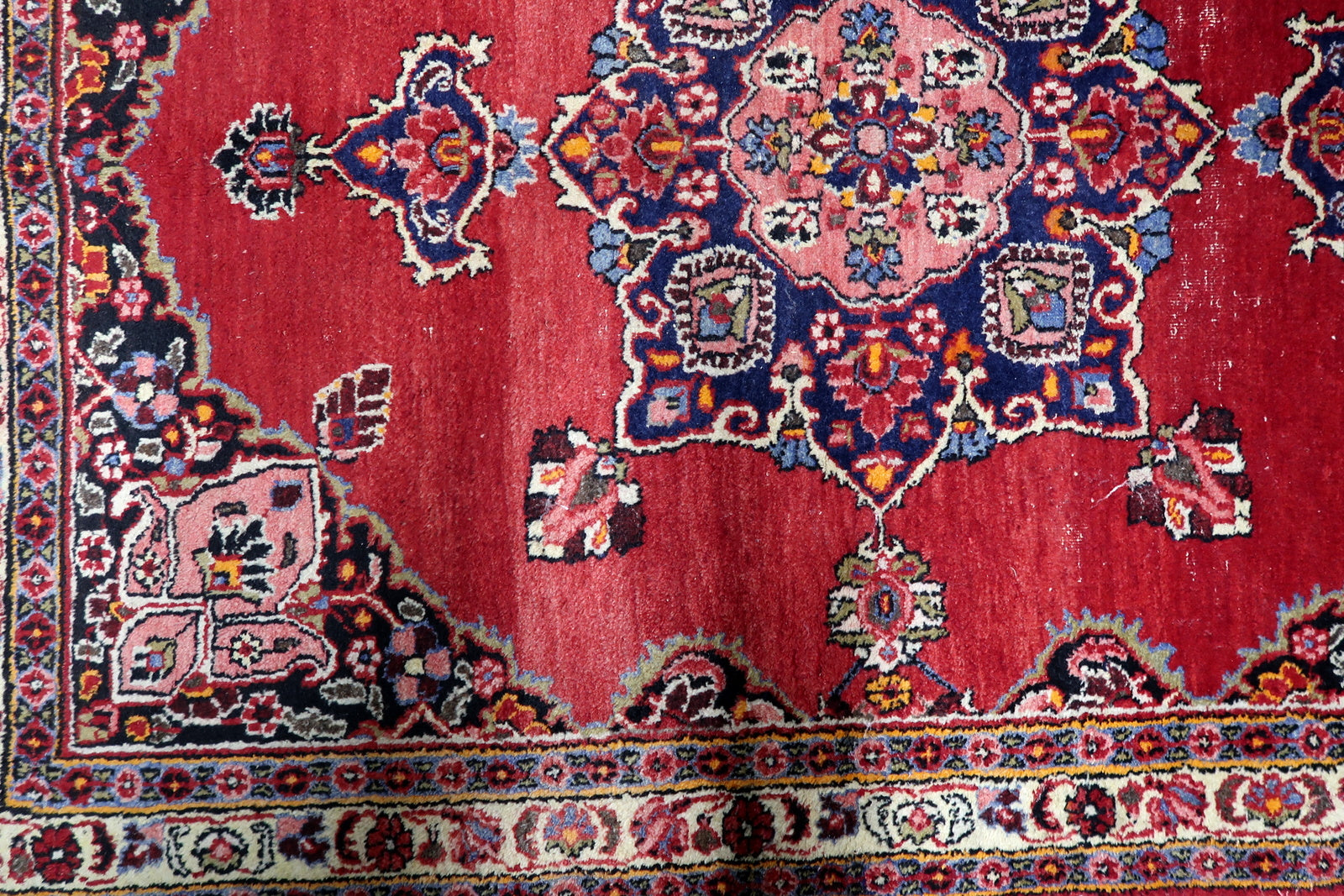 Detailed border showing traditional Persian floral and geometric motifs that enhance depth and movement