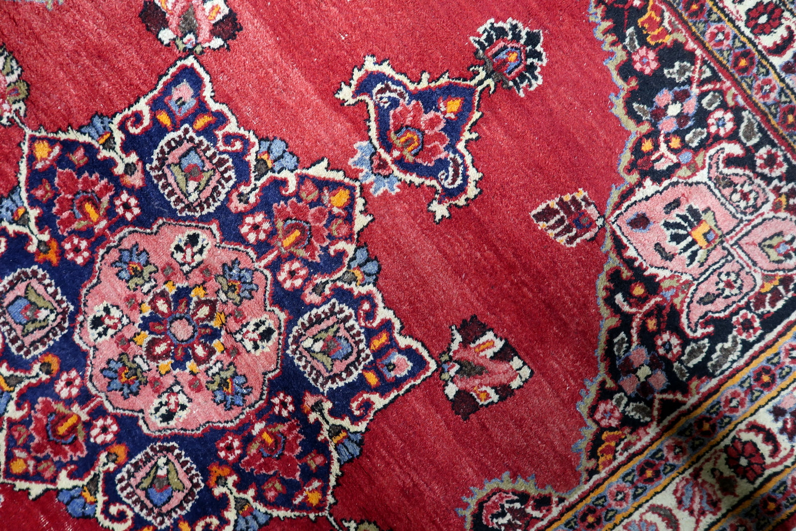 Soft resilient wool pile texture of a 1920s Kazvin rug with natural dyes retaining impressive vibrancy for its age