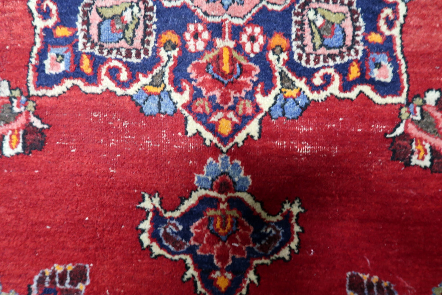 Antique 1920s Persian Kazvin carpet with refined artistry and balanced floral geometry characteristic of the region