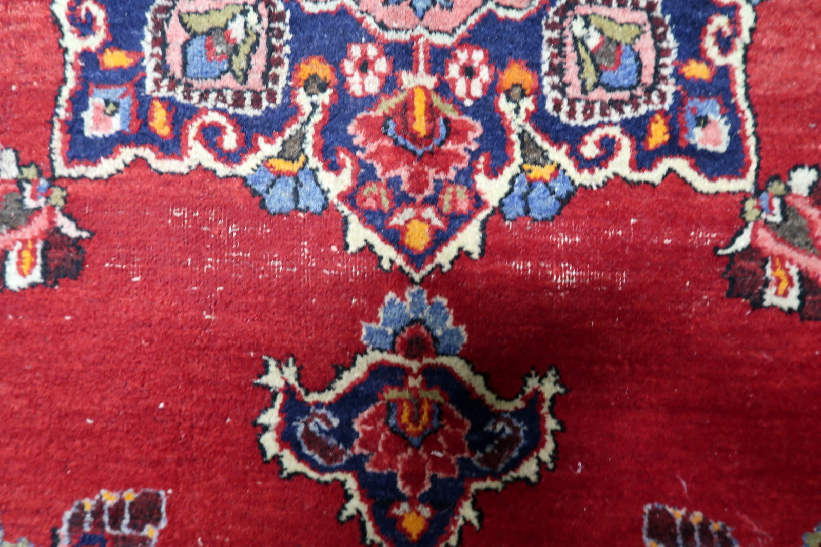 Antique 1920s Persian Kazvin carpet with refined artistry and balanced floral geometry characteristic of the region