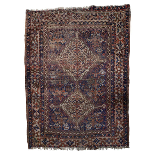 Antique 1880s Persian Khamseh wool rug in distressed condition with diamond medallions in earthy brown red blue and cream, 3.6 x 4.8 feet