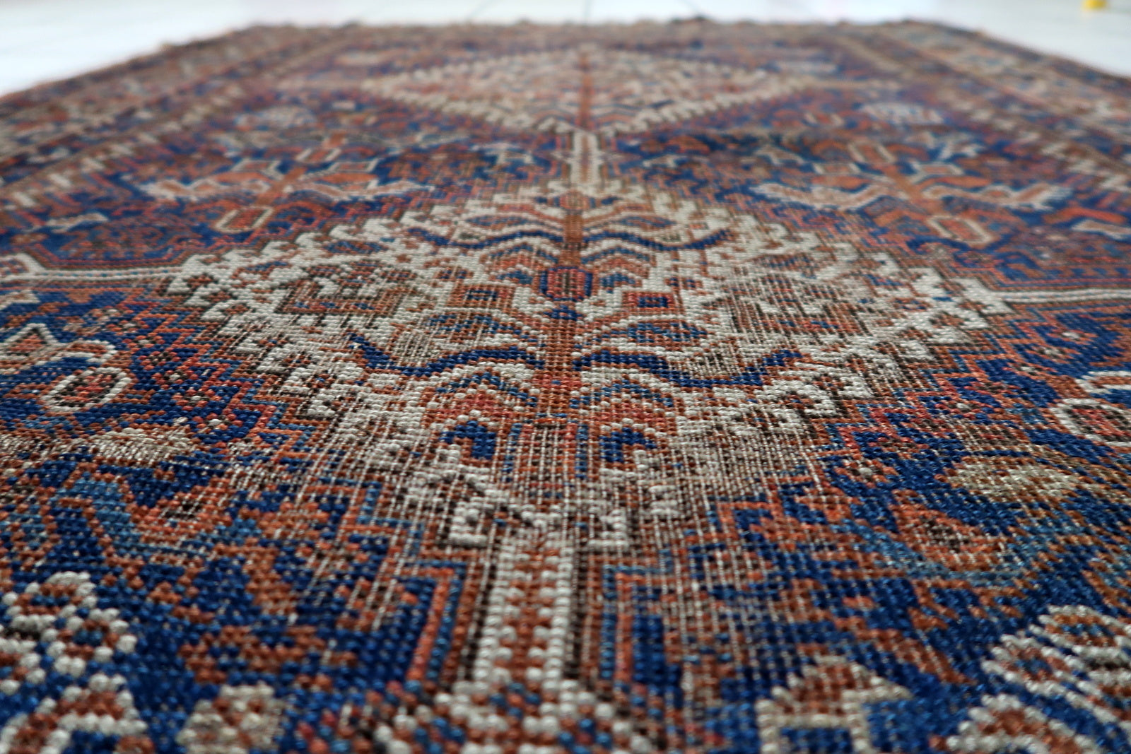 Persian tribal rug with compact proportions and historical presence from the late 19th century Khamseh confederation