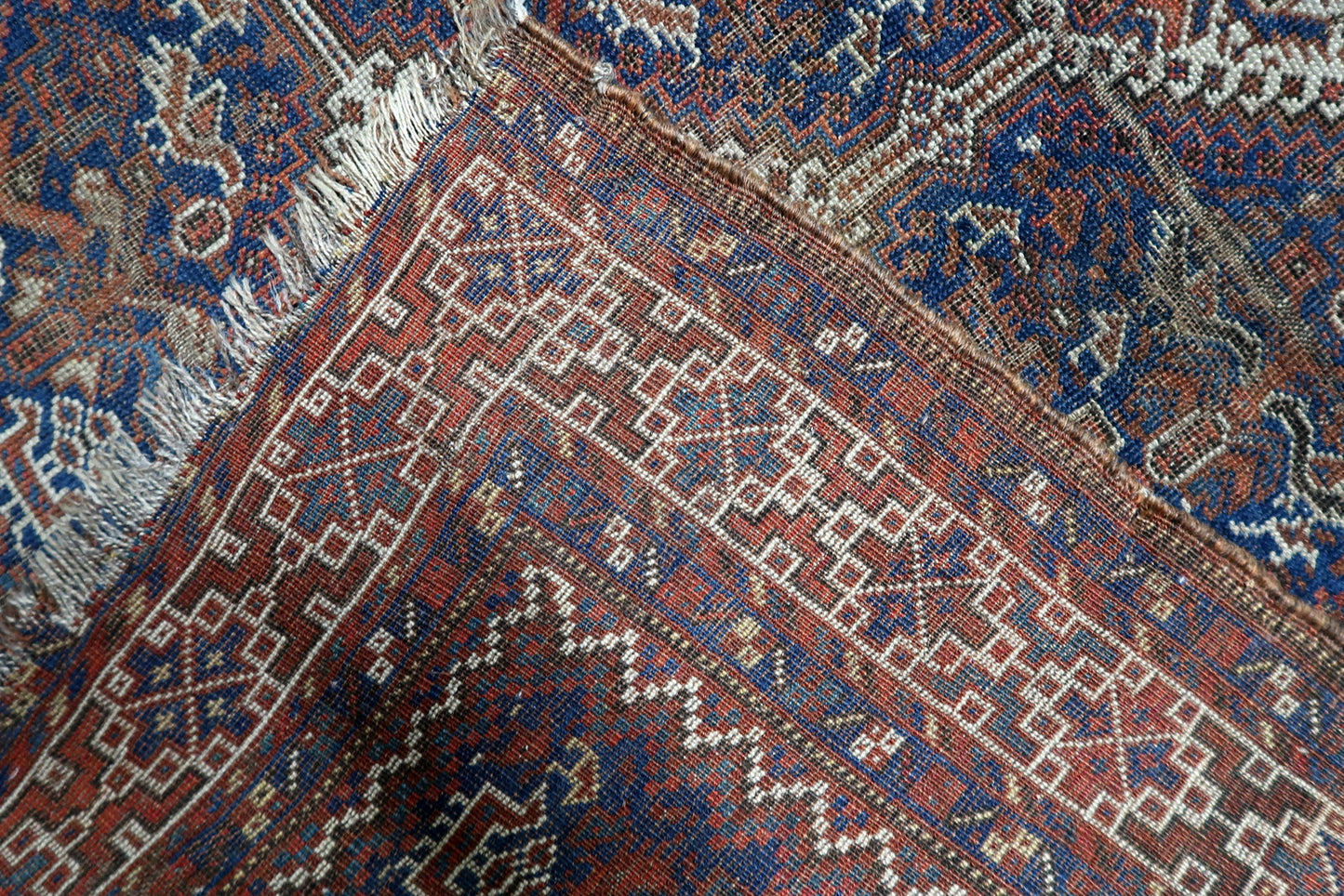 Small antique Persian carpet 110 x 147 cm with soulful patina and evocative 19th century tribal artistry