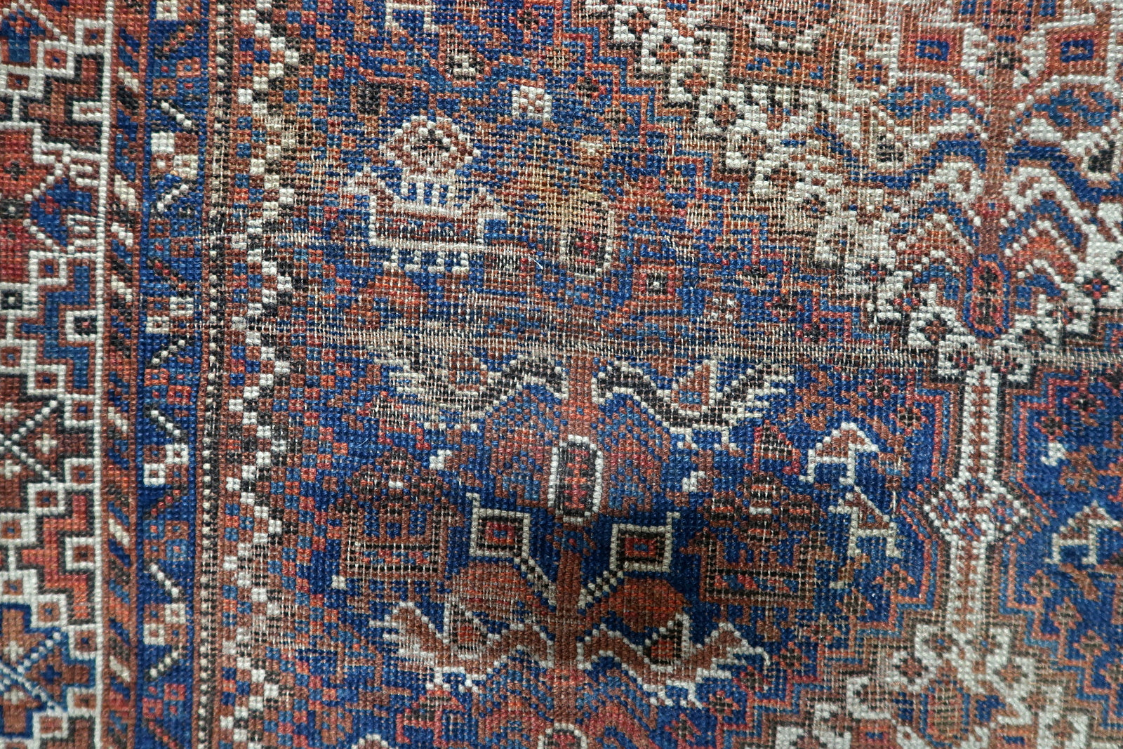 Antique 1880s Persian Khamseh carpet with lively rhythmic design and rich visual narrative of tribal weaving