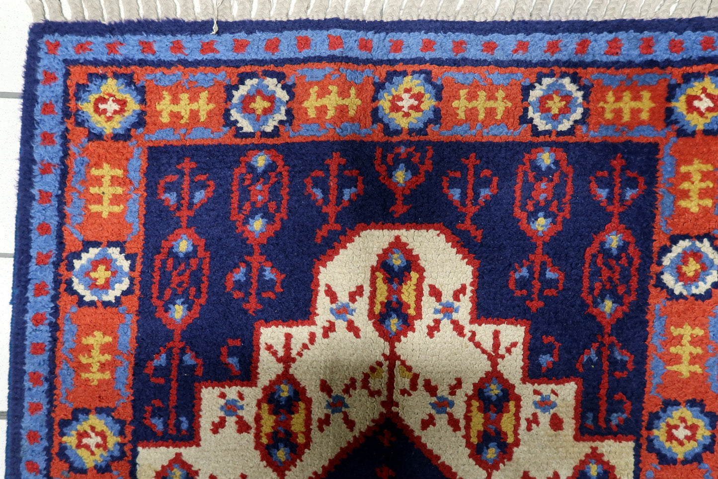 Vintage 1950s Savonnerie carpet reflecting refined decorative tradition with symmetrical composition and elegant accents