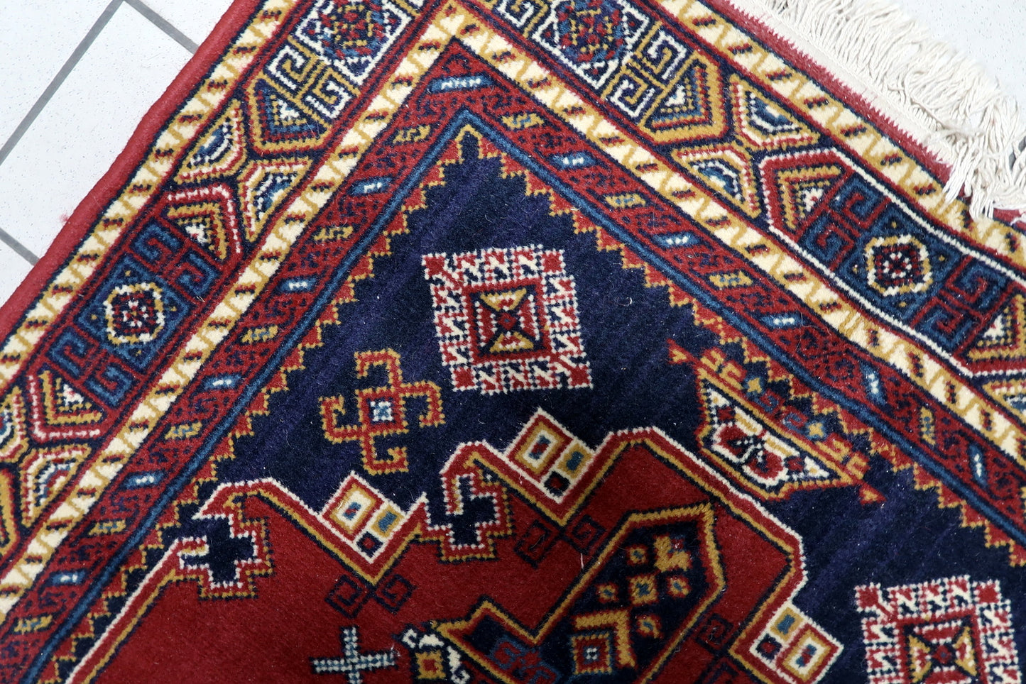Vintage wool rug Europe mid-century tribal angular borders good condition