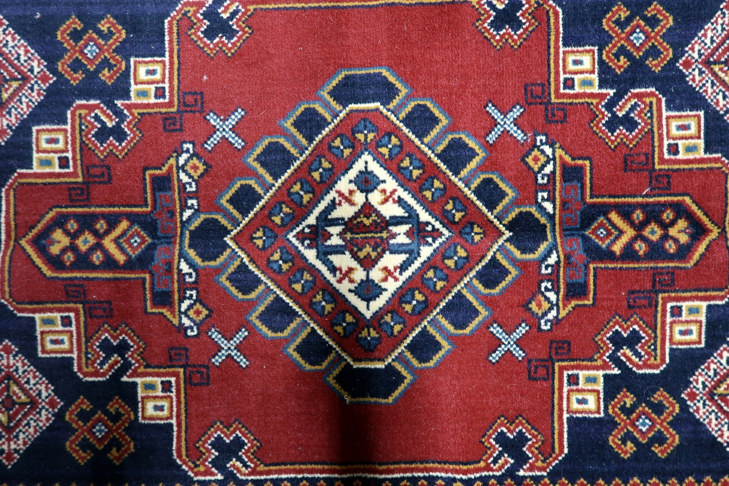 Vintage 1950s European Persian-style Shiraz wool rug with bold diamond medallion in red navy white yellow and black, 3.2 x 4.6 feet