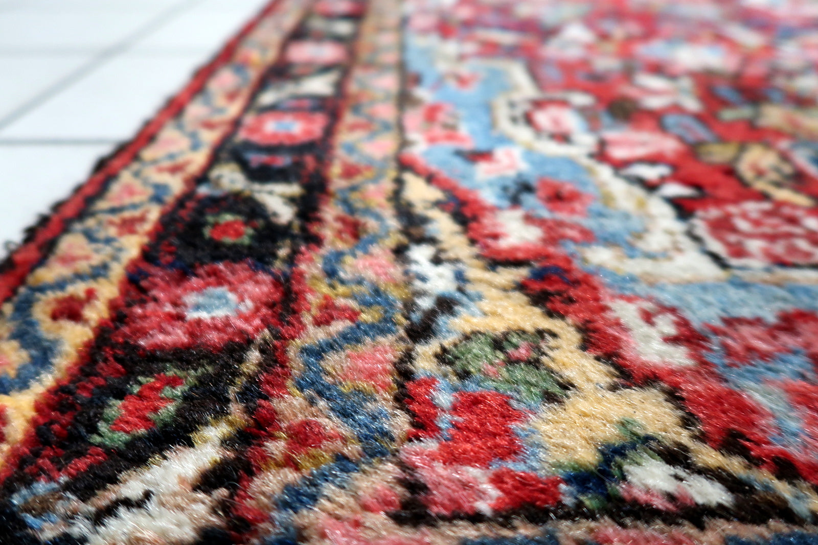 View of the long narrow proportions of an antique runner ideal for hallways, kitchens or galleries