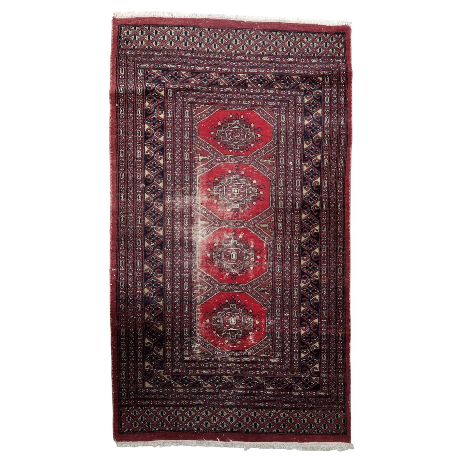 Antique Uzbek Bukhara rug 1930s distressed wool octagonal guls red brown
