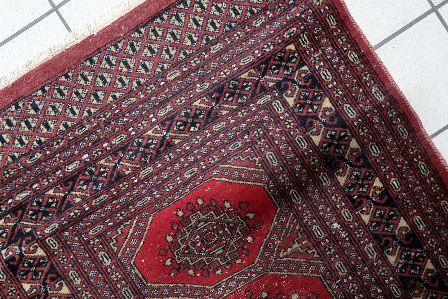 Hand-knotted antique rug Central Asian low pile tribal character