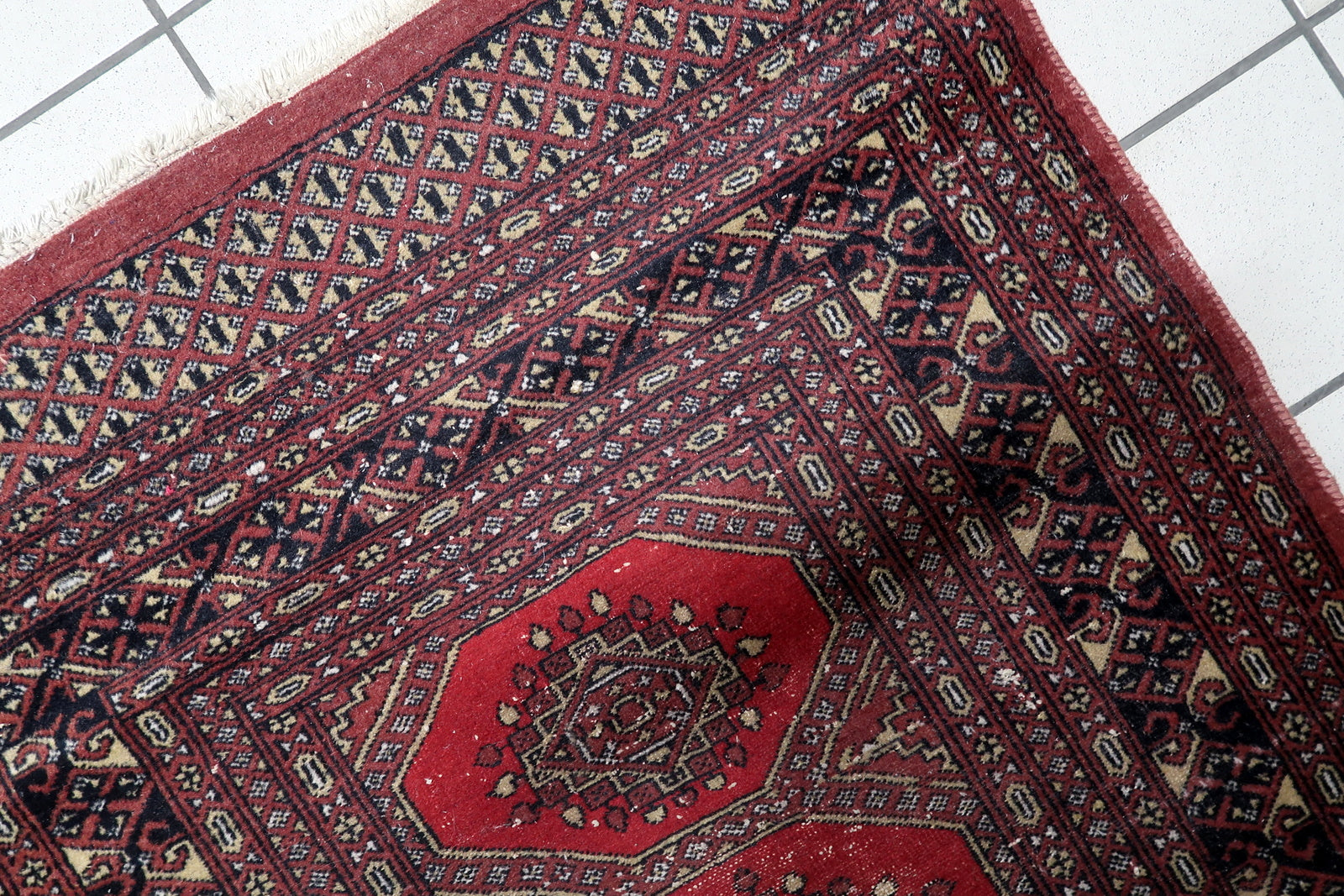 Hand-knotted antique rug Central Asian low pile tribal character
