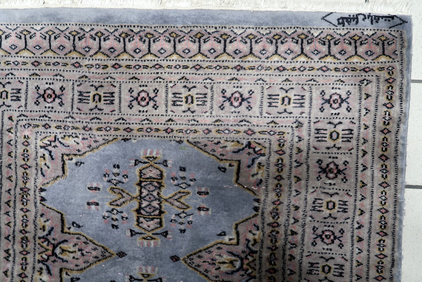 Hand-knotted vintage rug Uzbekistan good condition warm palette