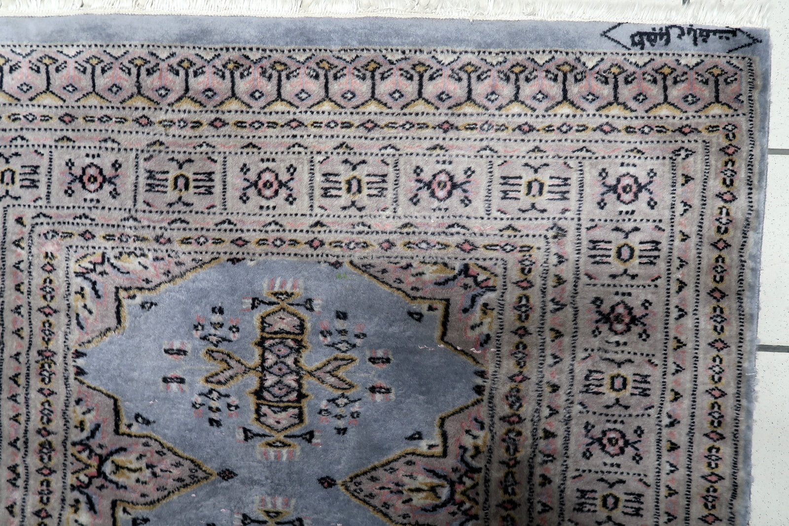 Hand-knotted vintage rug Uzbekistan good condition warm palette