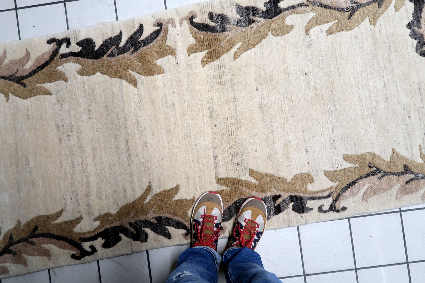 Long, narrow vintage Tibetan Khaden rug in beige and brown, ideally sized as a hallway runner or a bedside mat.


