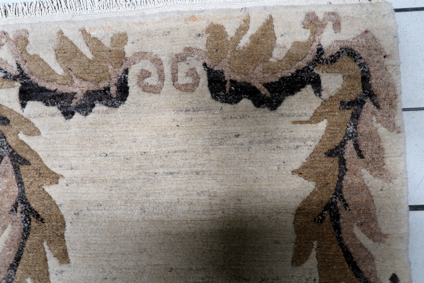Hand-knotted wool Tibetan Khaden rug, circa 1960s, with minimalist Art Deco design in neutral beige, brown, tan, and black tones.


