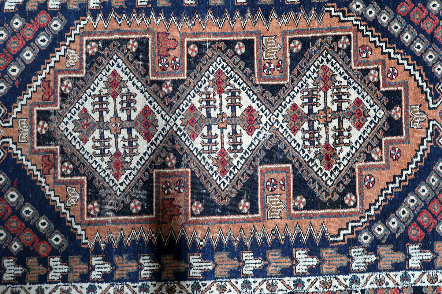 A vintage Persian Afshar accent rug, hand-knotted in wool, displaying the distinctive tribal artistry and patina of 1920s village craftsmanship.

