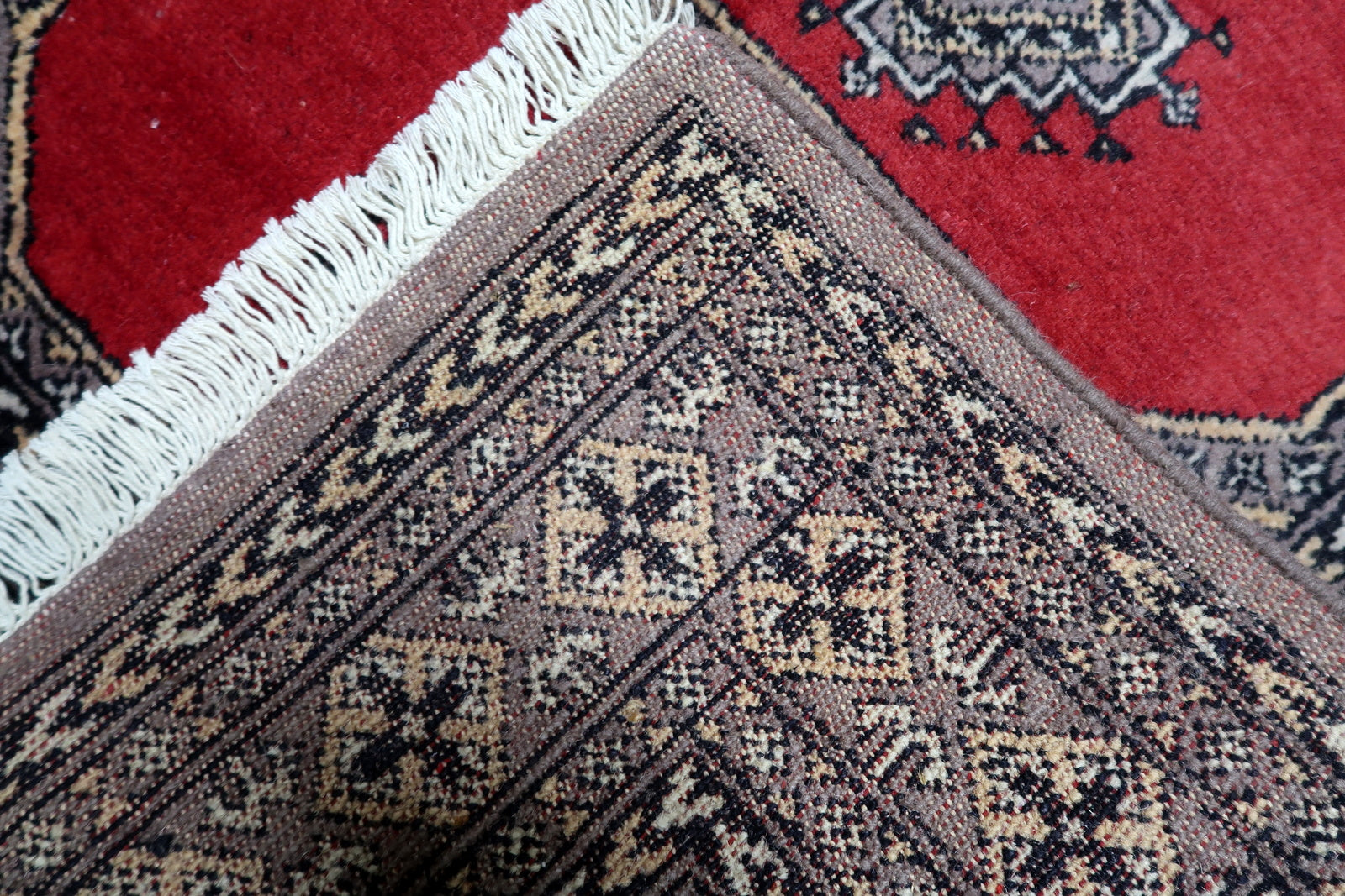 A 3 x 4.6 foot vintage Uzbek rug with a bold red field, ideally sized as a decorative accent for an entryway or small living space.

