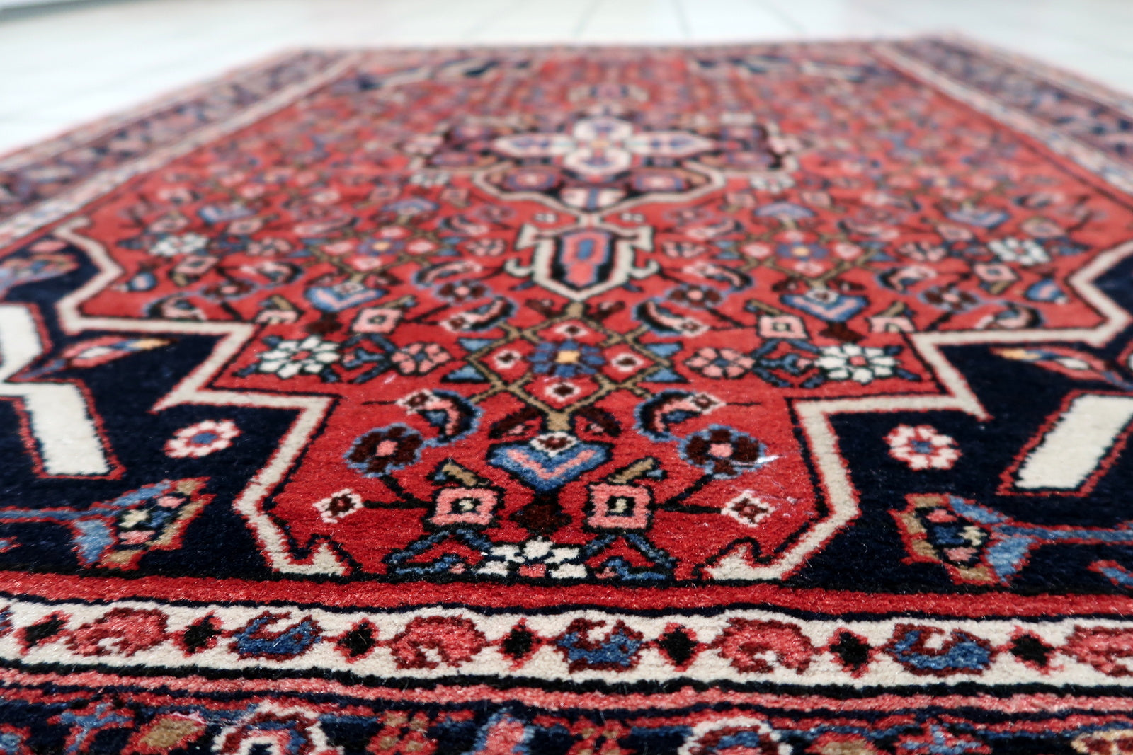 Detail of multiple borders with traditional Persian designs on 1940s Hamadan rug
