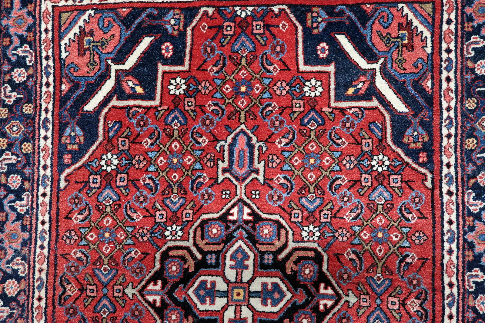 Close-up of vintage Hamadan rug from 1940s showing intricate geometric and floral patterns