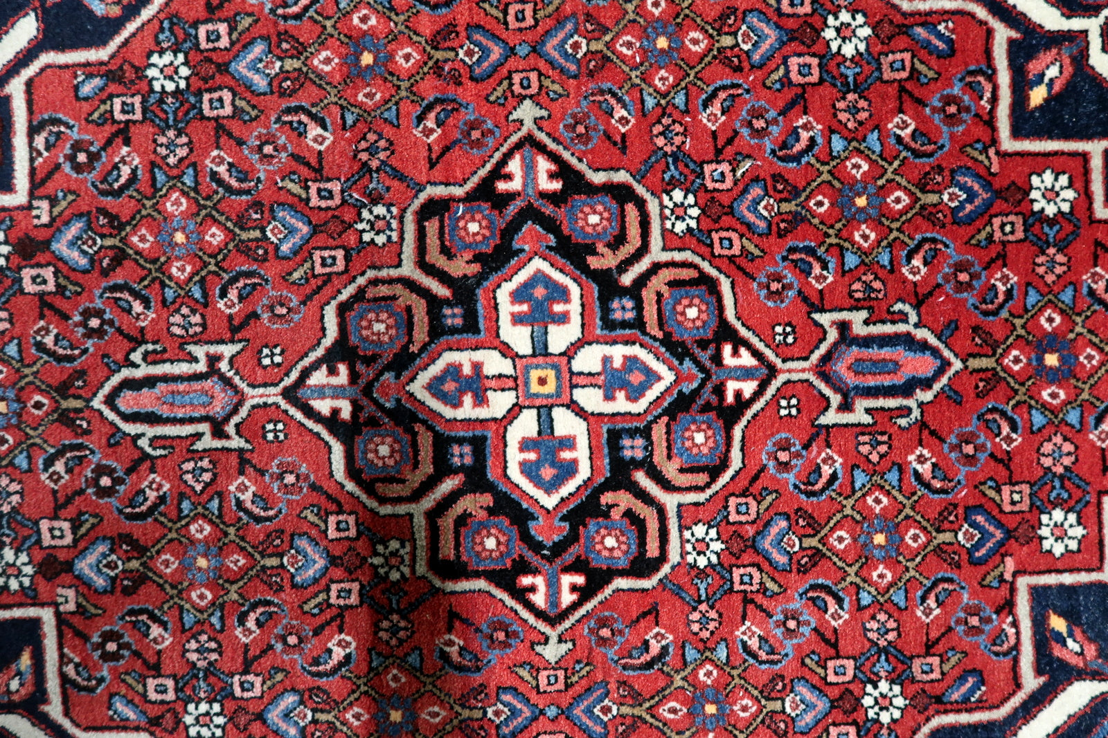 Small vintage Persian rug 3x4 ft size ideal for entryway or bedroom accent in room setting