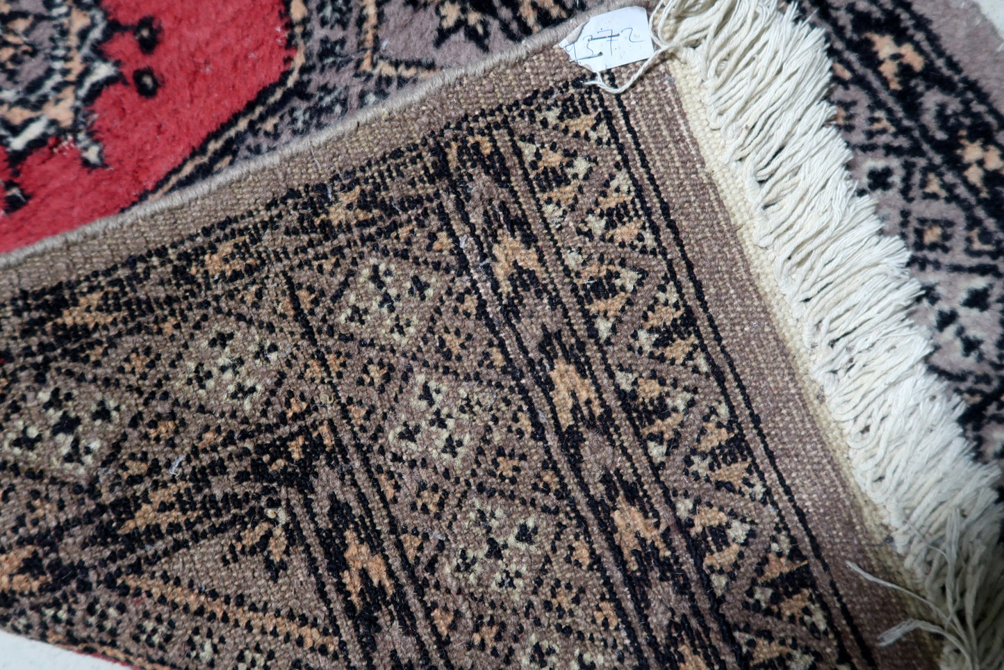 Corner detail showing multiple geometric borders on vintage Uzbek Bukhara hallway runner
