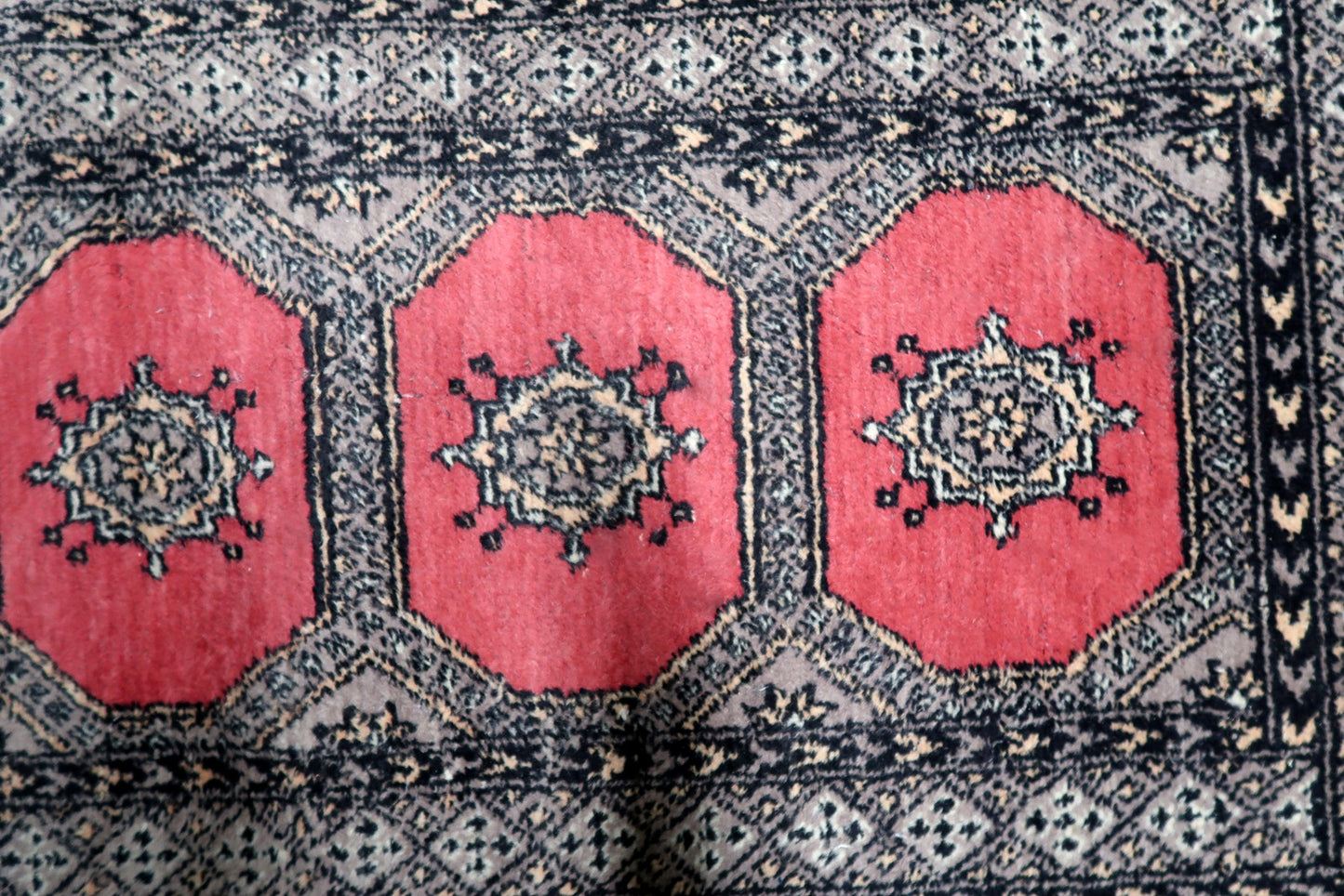 Vintage Uzbek carpet runner ideal for hallway entryway or kitchen laid in interior setting

