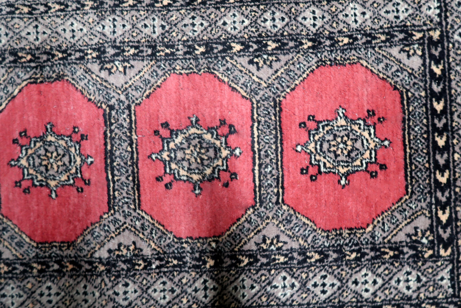 Vintage Uzbek carpet runner ideal for hallway entryway or kitchen laid in interior setting

