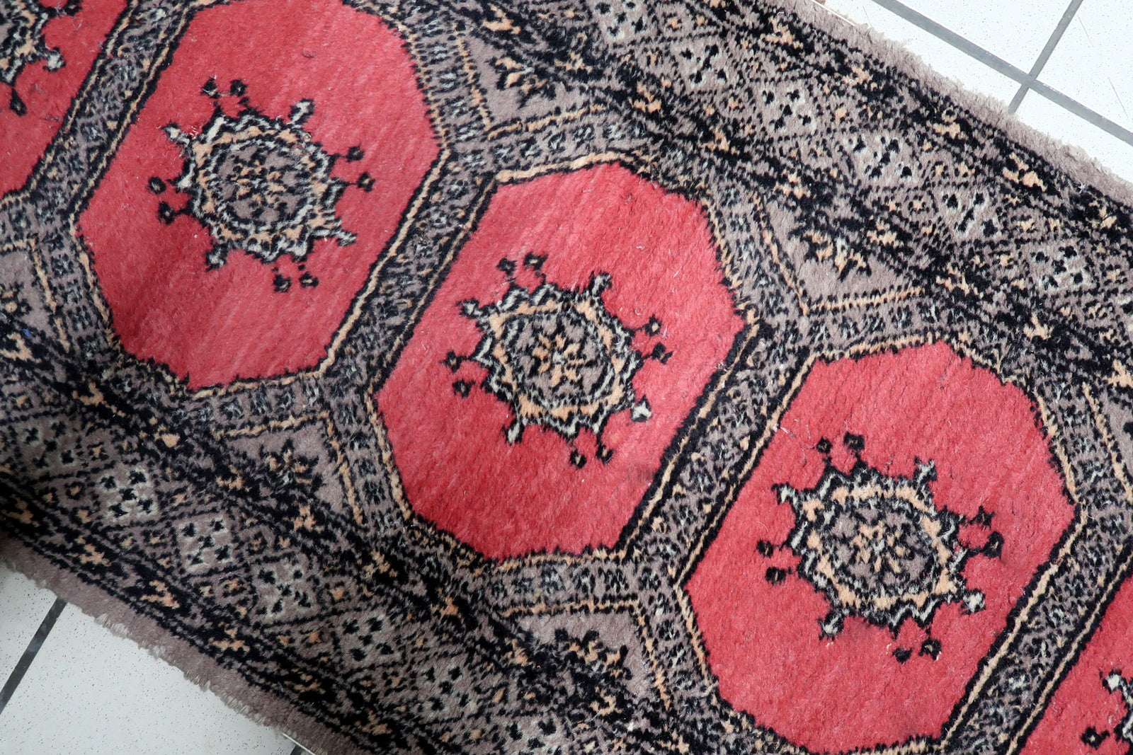 Handmade Bukhara runner Uzbekistan circa 1960s with red black ivory and beige color palette

