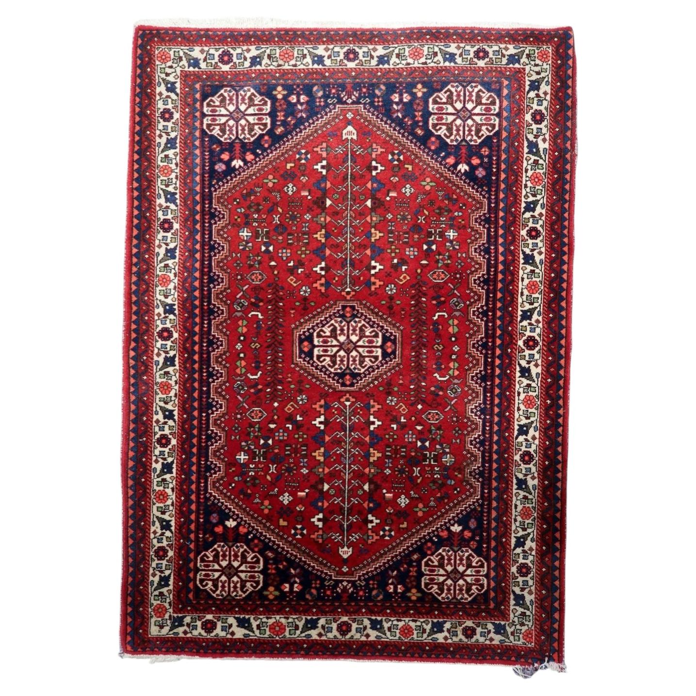Antique Persian Qashqai rug 1920s hand-knotted wool 3.5x5 ft full view with hexagonal medallion

