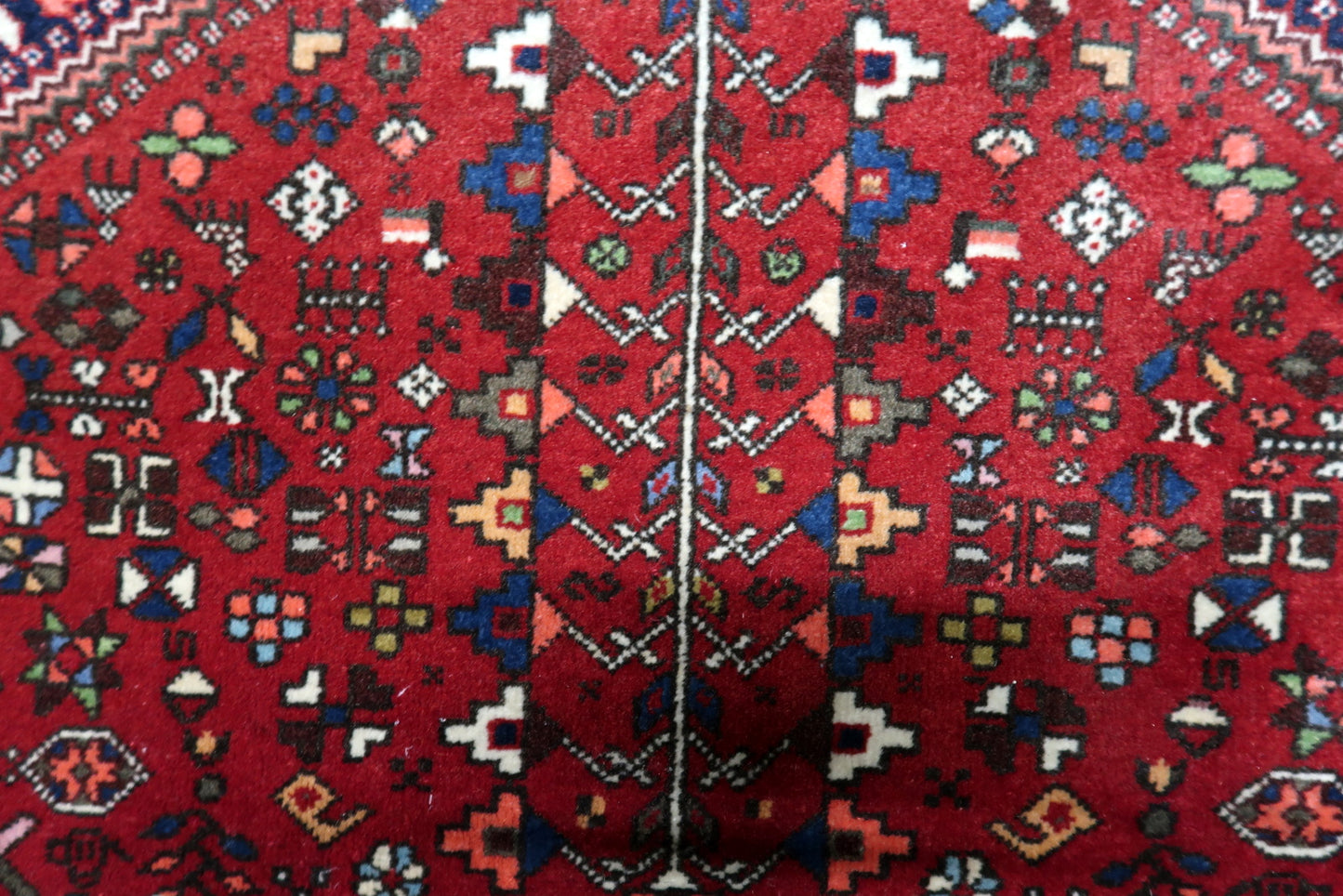 Antique Persian Gashkai rug texture and soft pile detail with light age-appropriate wear

