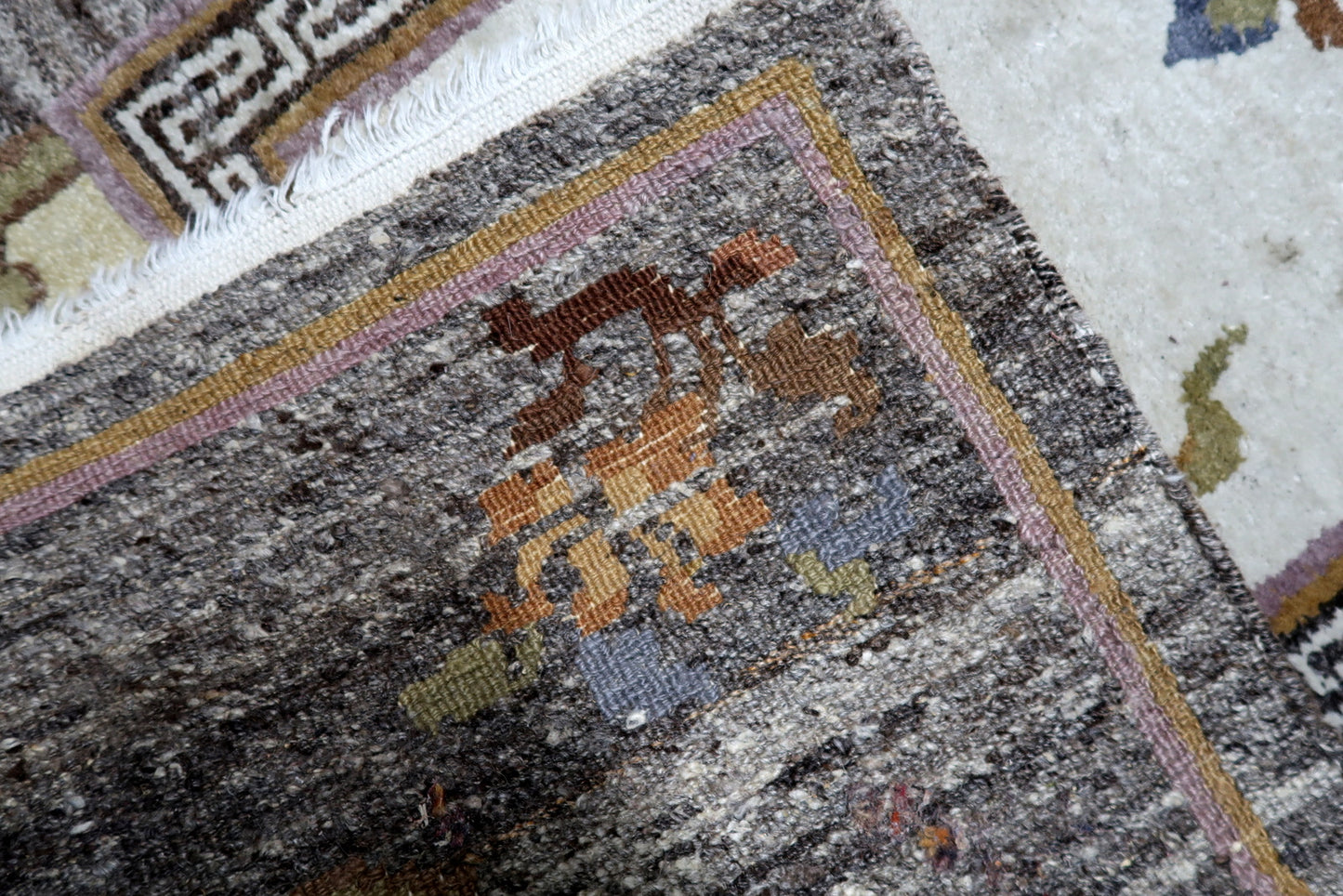 Vintage Tibetan Khaden rug design elements blending Himalayan tradition with Art Deco sensibilities
