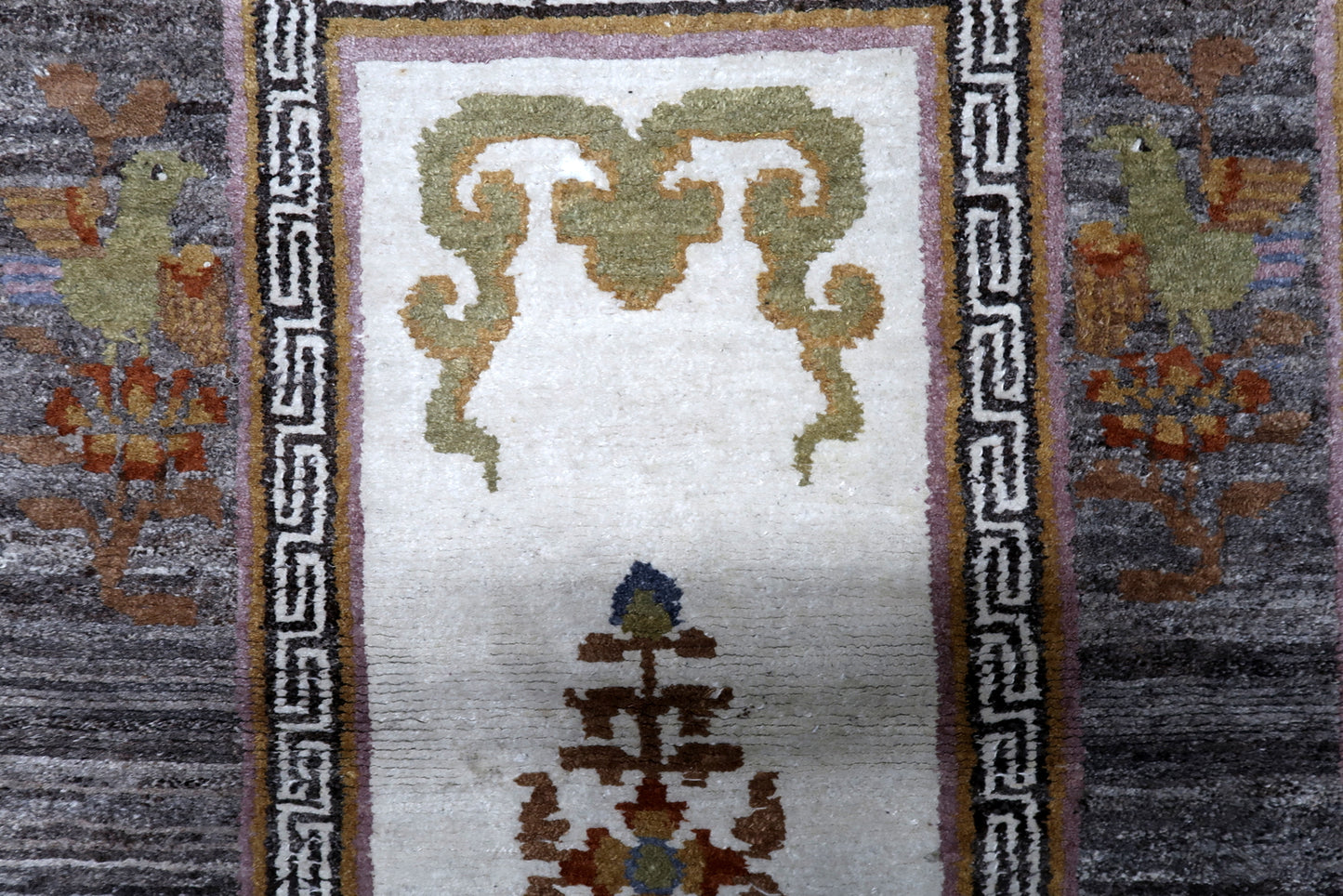 Handmade Khaden rug Tibet circa 1960s with charcoal ivory goldenrod and moss green colors

